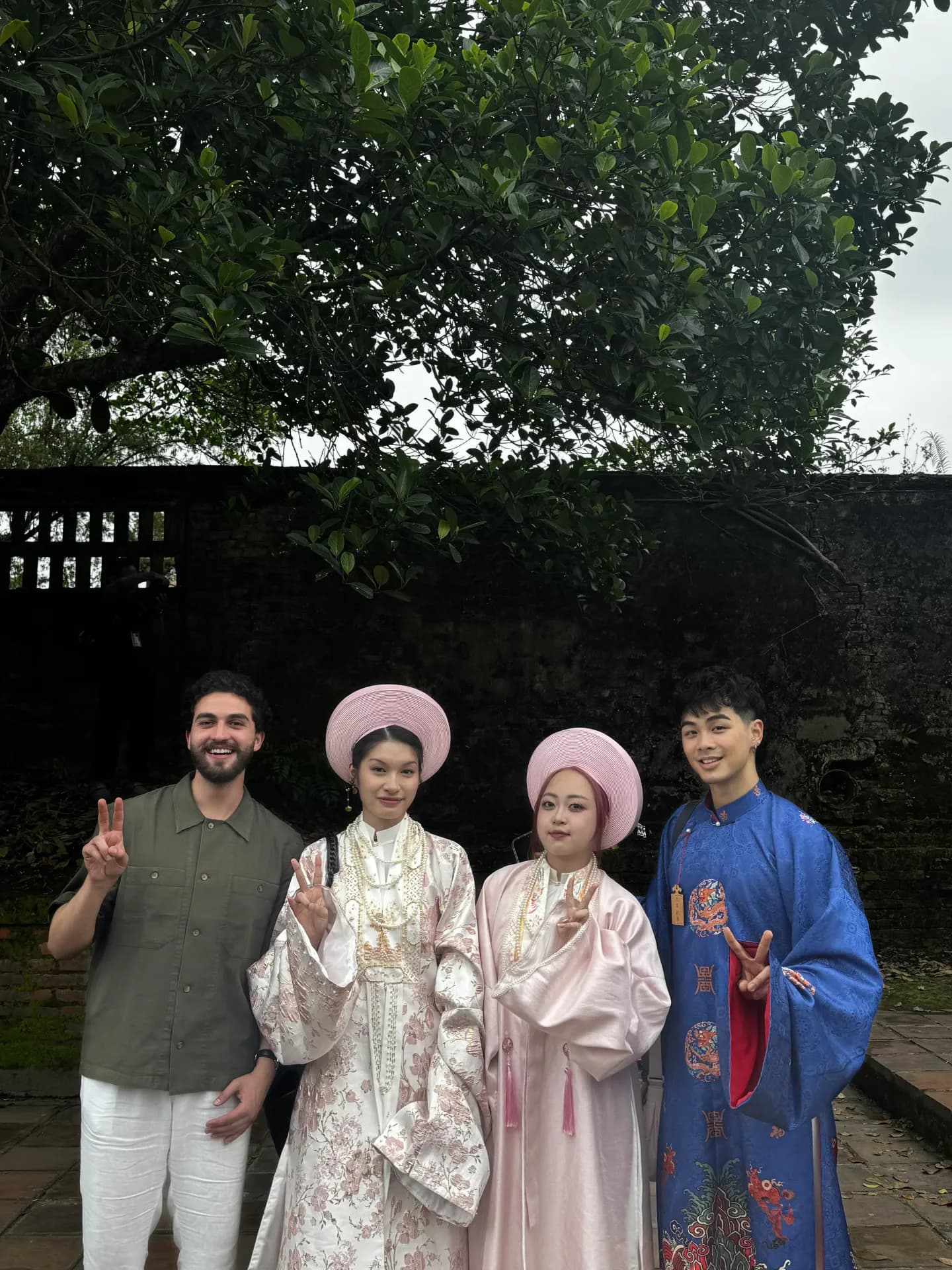 Hazem with tribe members in traditional Vietnamese imperial dress